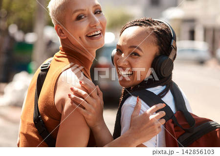 Friends, girls and portrait in city with laughing for bonding, funny joke and streetwear with bags on sidewalk in road. People, women and face in town with edgy style, trendy clothes and confidence 142856103