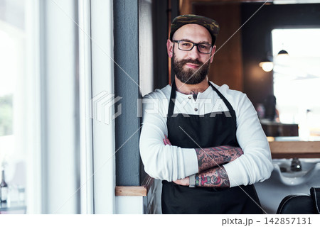 Barber, crossed arms and portrait of man for hair grooming, wellness and beard service. Small business, professional and person in barbershop, hairdresser and parlor for haircare, career or styling 142857131