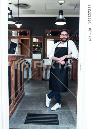 Barber, shop and portrait of man for hair grooming, wellness and beard service. Professional, small business and confident person in barbershop, salon and parlor for haircare, career and styling Barber, shop and portrait of man for hair grooming, wellness and beard service. Professional, small business and confident person in barbershop, salon and parlor for haircare, career and styling 142857286