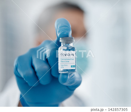 Hand, doctor and vaccine in vial for virus or research and treatment for prevention. Healthcare, investigation and medicine for pandemic or disease and person with injection and immunization Hand, doctor and vaccine in vial for virus or research and treatment for prevention. Healthcare, investigation and medicine for pandemic or disease and person with injection and immunization 142857305