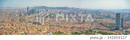 Panoramic view of Istanbul skyline featuring modern skyscrapers, historical buildings, and the Bosphorus Strait in Turkey on a clear sunny day Istanbul, Turkey Panoramic view of Istanbul skyline featuring modern skyscrapers, historical buildings, and the Bosphorus Strait in Turkey on a clear sunny day Istanbul, Turkey 142859127