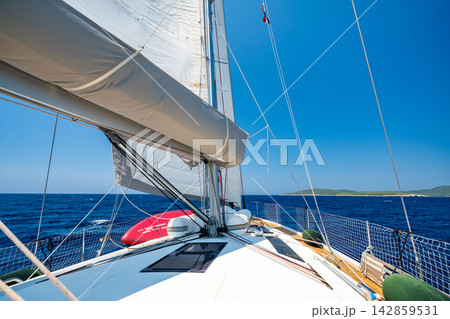 Sailing yacht cruising across the Adriatic Sea under full sail. Freedom and adventure during a long distance sailing voyage. 142859531