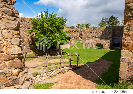 Interior courtyard and stone ruins of Tocnik Castle overlooking the Bohemian countryside. Medieval heritage and preservation concept 142860663