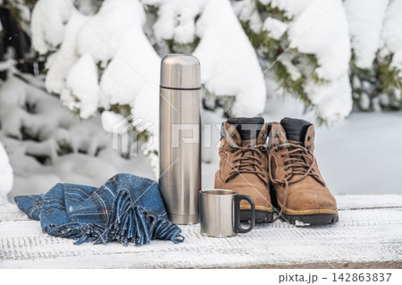 Winter hiking gear with hot drink Winter hiking gear with hot drink 142863837