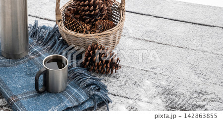 Hot coffee in winter outdoor setting Hot coffee in winter outdoor setting 142863855