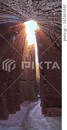 Slot Canyon Walls and Sunlit Passage in Cathedral Gorge State Park Nevada Slot Canyon Walls and Sunlit Passage in Cathedral Gorge State Park Nevada 142863892