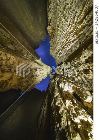 Cathedral Gorge Slot Canyon Walls with Blue Hour Sky and Dramatic Light Painting Cathedral Gorge Slot Canyon Walls with Blue Hour Sky and Dramatic Light Painting 142864007