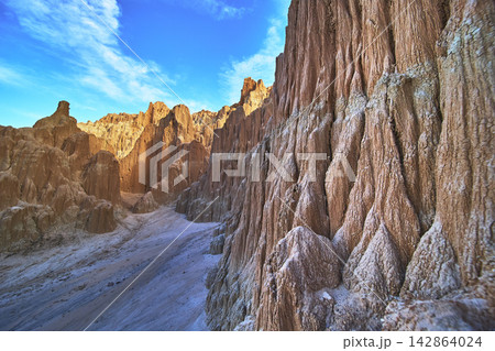 Cathedral Gorge State Park Slot Canyon Cliffs and Blue Sky in Nevada Cathedral Gorge State Park Slot Canyon Cliffs and Blue Sky in Nevada 142864024