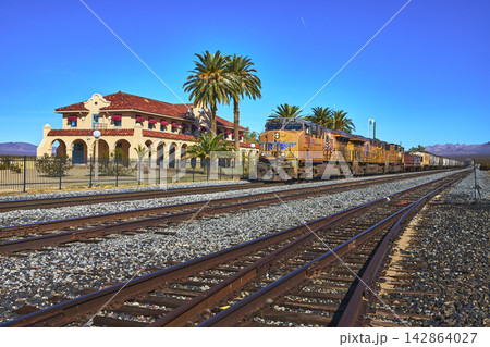 Kelso Depot Visitors Center Freight Train and Railroad Tracks in Mojave Desert California Kelso Depot Visitors Center Freight Train and Railroad Tracks in Mojave Desert California 142864027
