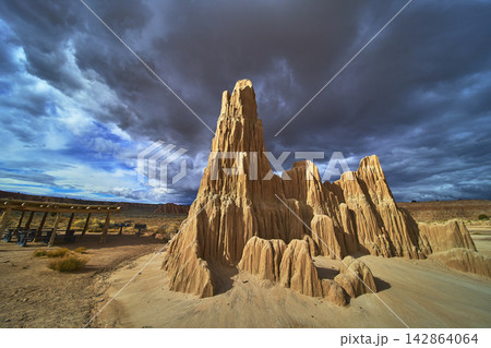 Cathedral Gorge Dramatic Rock Formations and Desert Landscape Under Storm Clouds 142864064