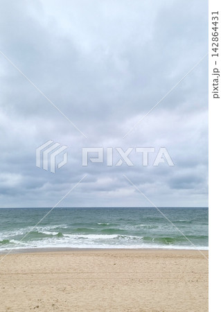 Tranquil Ocean View with Cloudy Sky at Deserted Beach for Relaxation Themes 142864431