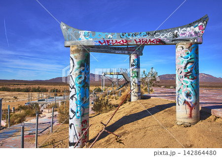 Abandoned Graffiti Covered Water Park Structure and Desert Landscape California Abandoned Graffiti Covered Water Park Structure and Desert Landscape California 142864480