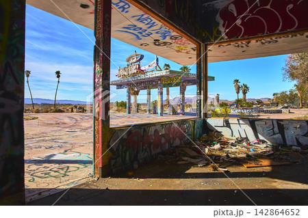 Abandoned Lake Dolores Water Park Graffiti Covered Building and Desert Palms California 142864652