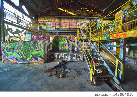 Abandoned Goldome Mill Interior With Graffiti Art And Yellow Industrial Staircase 142864810