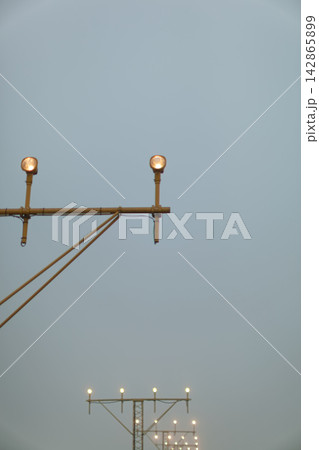 Airport approach lights with clear sky Airport approach lights with clear sky 142865899