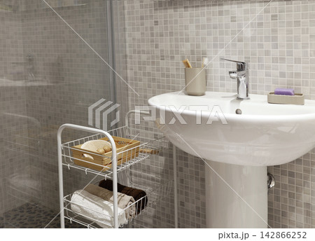 Bathroom renovation result with new ceramic mosaic tiles wall. 142866252