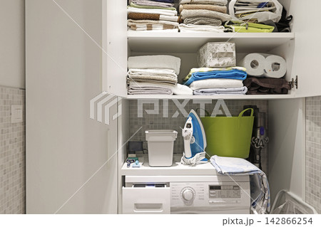 Home laundry cabinet organization and smart storage solutions. 142866254