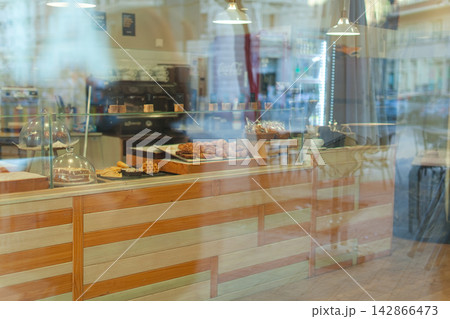 Bakery counter with pastries and coffee machine Bakery counter with pastries and coffee machine 142866473