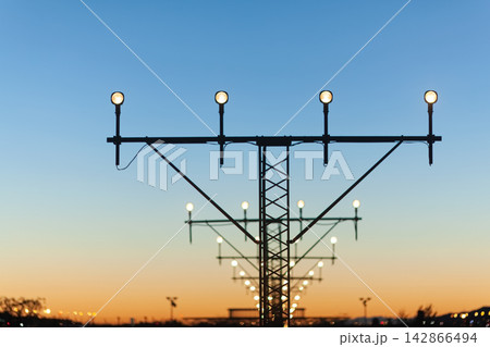 Airport runway lights at sunset 142866494
