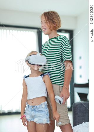 Children playing with vr headset indoors 142866526