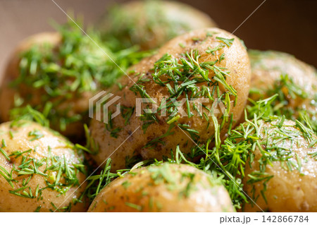 Boiled baby potato with fresh dill macro close up detail Boiled baby potato with fresh dill macro close up detail 142866784
