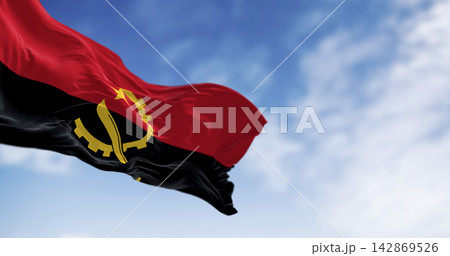 Close-up of Angola national flag waving in the wind on a clear day 142869526