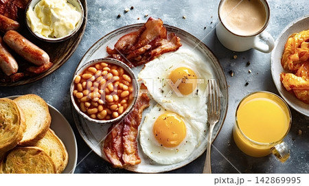 Classic full english breakfast serving eggs, bacon, beans, and coffee Classic full english breakfast serving eggs, bacon, beans, and coffee 142869995
