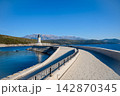 Lustica Lighthouse And Mountains Above The Blue Adriatic 142870345