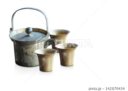 side view antique one brass kettle and three brass cup, on white background, decor, kitchen, fashion, collection, ancient, copy space side view antique one brass kettle and three brass cup, on white background, decor, kitchen, fashion, collection, ancient, copy space 142870434