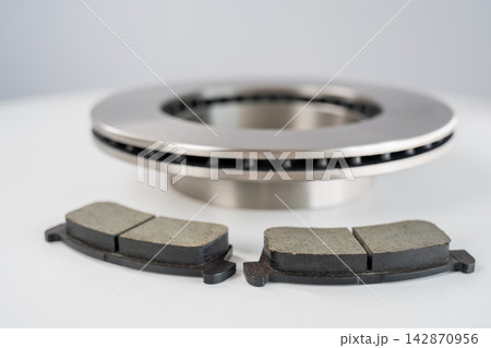 A close-up of new brake discs on a white background. 142870956