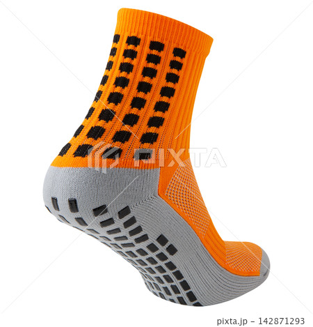 Orange and grey anti slip athletic sock with rubber grips on sole isolated on white background Orange and grey anti slip athletic sock with rubber grips on sole isolated on white background 142871293