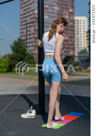 A woman with cerebral palsy walks on sensory mats. Rehabilitation 142871925