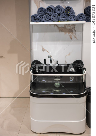A tub of water in a grooming salon. A tub of water in a grooming salon. 142872831