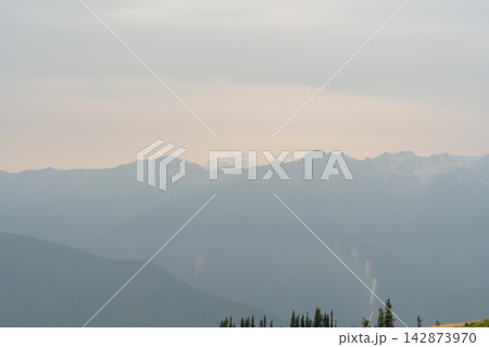A stunning view of mountains on a rainy day from atop Hurricane Ridge. A stunning view of mountains on a rainy day from atop Hurricane Ridge. 142873970