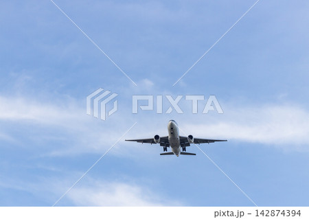 Airplane and sky, the plane is landing. Airplane take off on the blue sky Airplane and sky, the plane is landing. Airplane take off on the blue sky 142874394