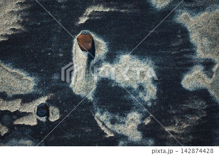 Close-up abstract of perfect wind ripple patterns in white sand dunes forming gentle waves 142874428