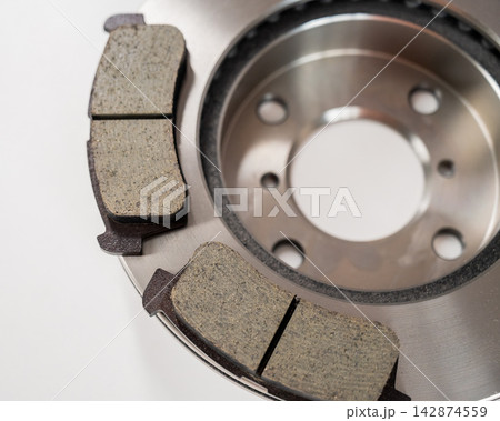 A close-up of new brake discs on a white background. 142874559
