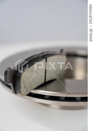 A close-up of new brake discs on a white background. A close-up of new brake discs on a white background. 142874560
