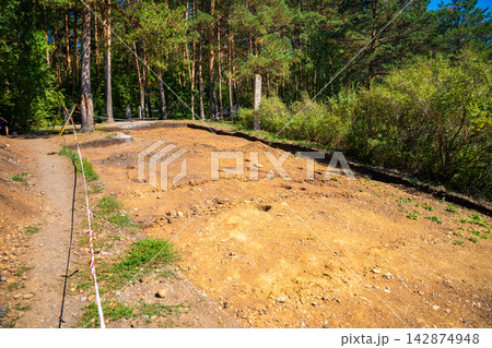 Archaeological excavation site near Tomskaya Pisanitsa in Siberia. Excavated soil layers represent research and discovery of ancient human history Archaeological excavation site near Tomskaya Pisanitsa in Siberia. Excavated soil layers represent research and discovery of ancient human history 142874948