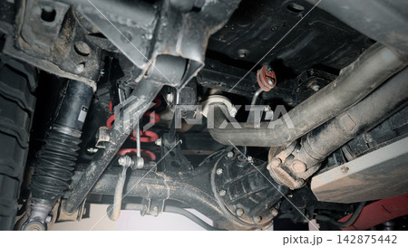 Car suspension and drive shaft. Structure of EV car spare parts. Such as Front or Rear suspension Shock absorber suspension Brake. Elements of the suspension and Chassis structure. Car service repair. 142875442