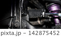 Car suspension and drive shaft. Structure of EV car spare parts. Such as Front or Rear suspension Shock absorber suspension Brake. Elements of the suspension and Chassis structure. Car service repair. 142875452