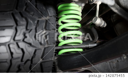 Car suspension and drive shaft. Structure of EV car spare parts. Such as Front or Rear suspension Shock absorber suspension Brake. Elements of the suspension and Chassis structure. Car service repair. Car suspension and drive shaft. Structure of EV car spare parts. Such as Front or Rear suspension Shock absorber suspension Brake. Elements of the suspension and Chassis structure. Car service repair. 142875455