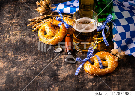 Bavarian brezel and beer, Oktoberfest food Bavarian brezel and beer, Oktoberfest food 142875980