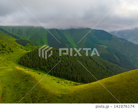 Panoramic View of Lush Green Mountains Under Cloudy Sky in Kyrgyzstan Panoramic View of Lush Green Mountains Under Cloudy Sky in Kyrgyzstan 142876174