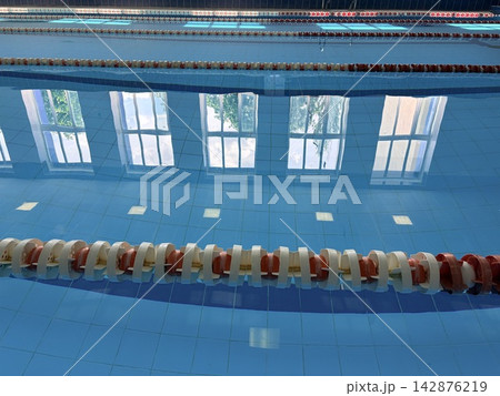 An empty swimming pool with red and white buoys. Concept of sports competitions and active lifestyle. 142876219