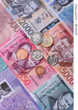 Jamaica, Jamaican paper money, dollar banknotes and cent coins for exchange. Jamaica money Jamaica, Jamaican paper money, dollar banknotes and cent coins for exchange. Jamaica money 142877402