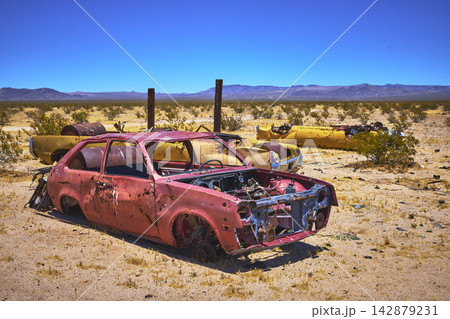 Abandoned Rusted Cars in Mojave Desert California Under Bright Sunlight Abandoned Rusted Cars in Mojave Desert California Under Bright Sunlight 142879231