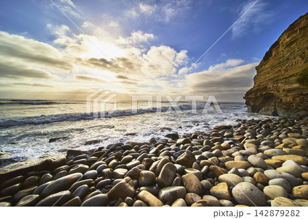 Rocky Beach and Ocean Waves at Sunset Cliffs with Dramatic Sky Rocky Beach and Ocean Waves at Sunset Cliffs with Dramatic Sky 142879282