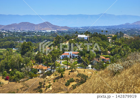 Elevated View California Suburban Homes Lush Palms and Distant San Bernardino Mountains Elevated View California Suburban Homes Lush Palms and Distant San Bernardino Mountains 142879919