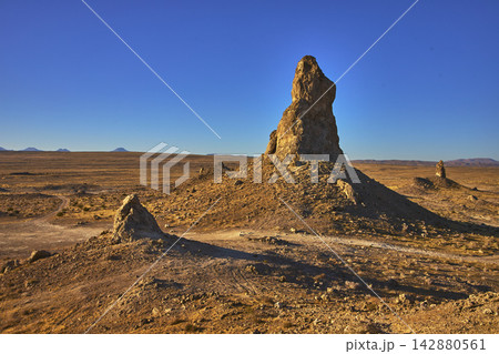 Trona Pinnacles Tufa Spires in California Desert Under Golden Hour Light 142880561